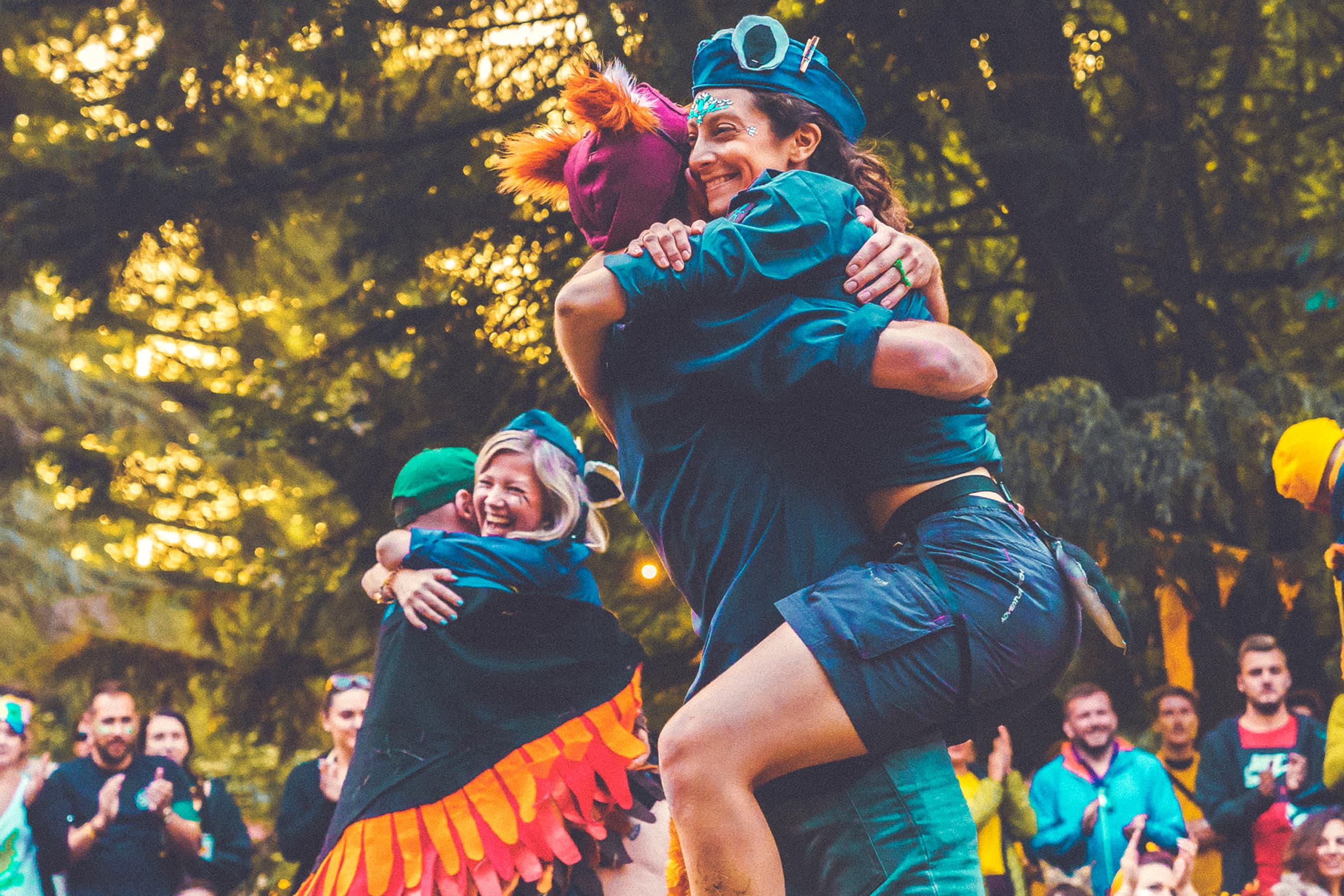 Two people hugging, one carrying the other.