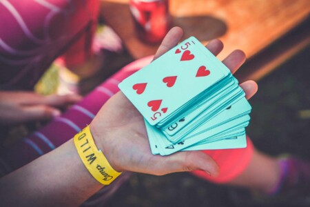 Deck of cards at Camp Wildfire. A summer weekend break in a forest near London and Kent. An outdoor woodland retreat featuring adventure activities, live music, DJs, parties and camping. Half summer adventure activity camp, half music festival, for adults only.