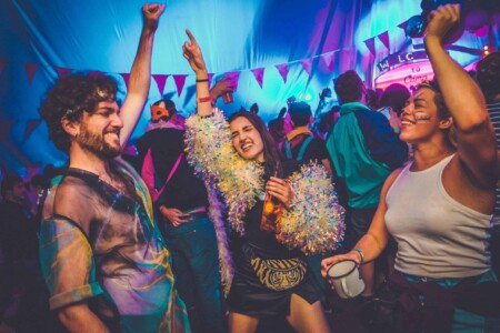 People partying on the dance floor in the discotheque tent at Camp Wildfire.